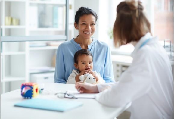 woman and child smiling with team member in Morgan Hill